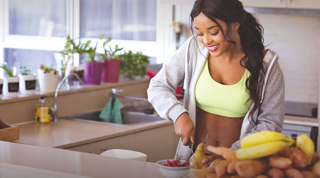 A person enjoying healthy food with fresh vegetables and fermented dishes promoting mindful nutrition.